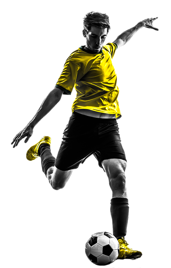 footballe kicking a ball of fultbol